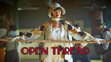 Miss Fisher stands with arms extended, hands resting on a large rope in front of her (a boxing ring). Text reads Open Thread.
